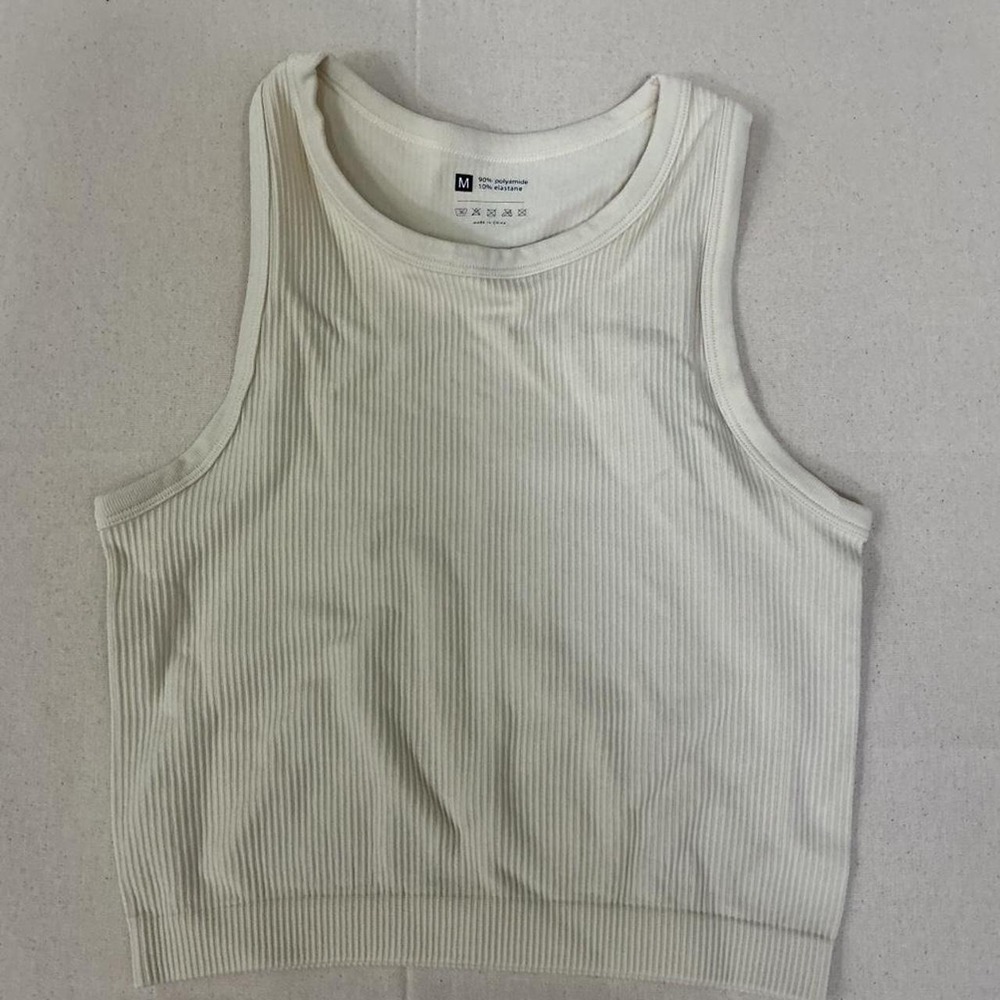 Minimalist‎ cream ribbed cropped tank top with a soft stretchy fit 🤍